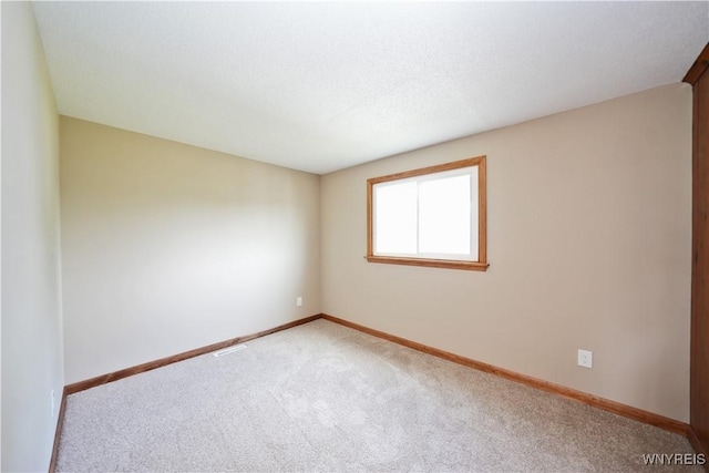 22 Vanderbilt Ave, Cheektowaga, NY 14043 - spare room featuring light colored carpet and baseboards