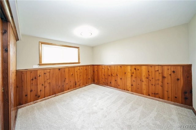 22 Vanderbilt Ave, Cheektowaga, NY 14043 - carpeted empty room featuring wainscoting and wood walls
