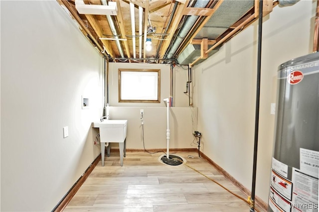 22 Vanderbilt Ave, Cheektowaga, NY 14043 - laundry area featuring gas water heater, light wood-style flooring, and washer hookup