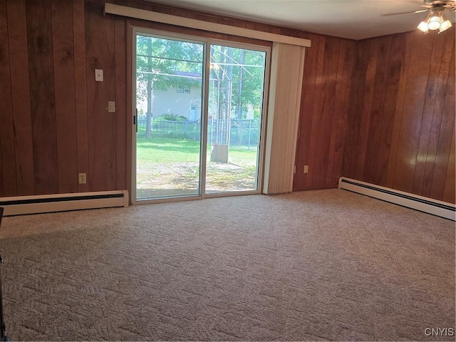 4777 Glencrest Ave, Clay, NY 13088 - unfurnished room with a baseboard radiator, wooden walls, a ceiling fan, and carpet