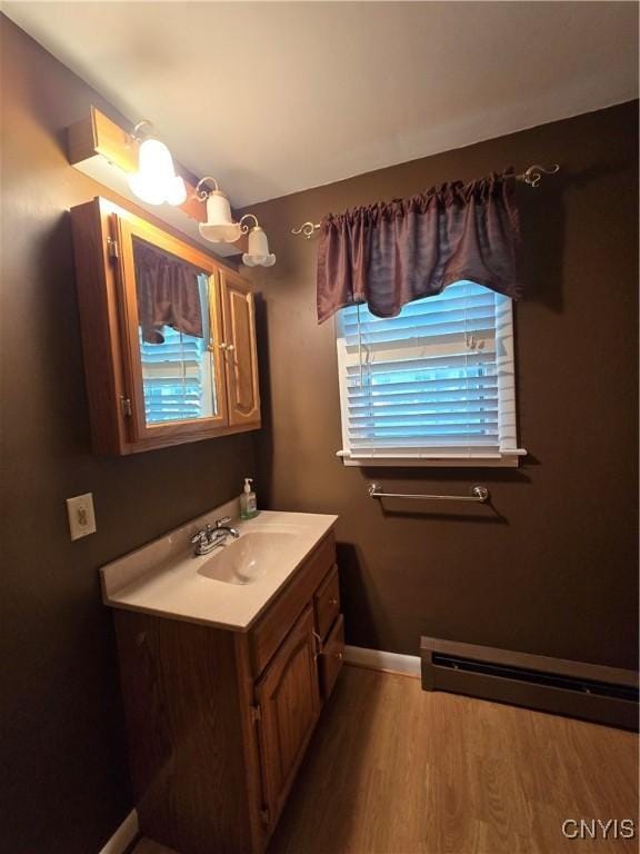 4777 Glencrest Ave, Clay, NY 13088 - bathroom with vanity, wood finished floors, and a baseboard heating unit