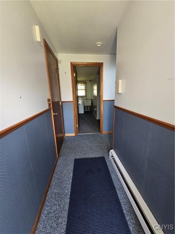 4777 Glencrest Ave, Clay, NY 13088 - corridor with carpet floors and baseboard heating