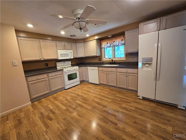 4777 Glencrest Ave, Clay, NY 13088 - kitchen with white appliances, dark countertops, wood finished floors, ceiling fan, and recessed lighting
