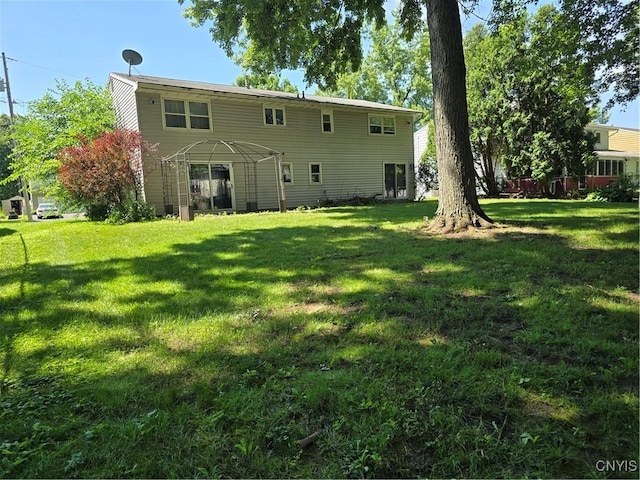4777 Glencrest Ave, Clay, NY 13088 - rear view of house with a lawn