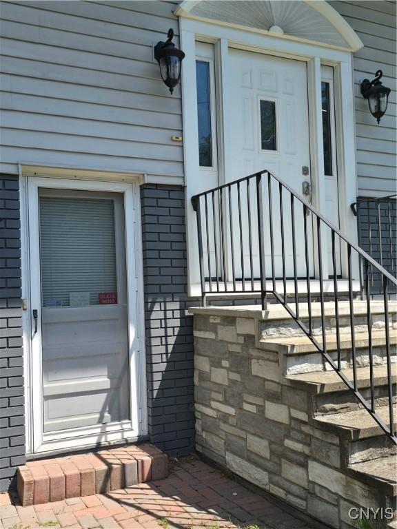 4777 Glencrest Ave, Clay, NY 13088 - entrance to property featuring brick siding