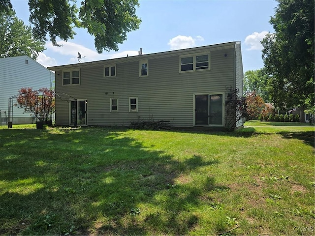 4777 Glencrest Ave, Clay, NY 13088 - rear view of house with a lawn