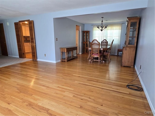 4777 Glencrest Ave, Clay, NY 13088 - dining space with a chandelier and light wood-style floors