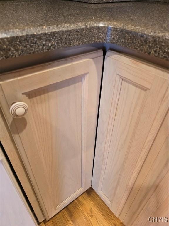 4777 Glencrest Ave, Clay, NY 13088 - detailed view of dark countertops and light wood finished floors