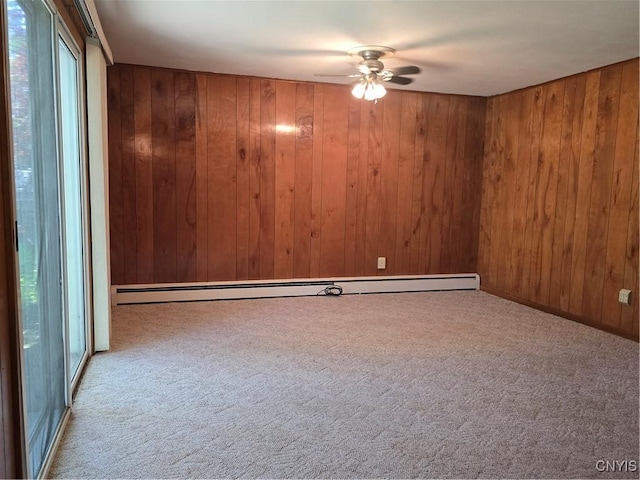 4777 Glencrest Ave, Clay, NY 13088 - spare room with carpet floors, ceiling fan, plenty of natural light, and wood walls