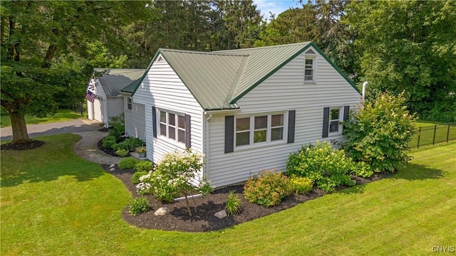200 Audubon Rd, Manlius, NY 13066 - view of home's exterior with a metal roof, a garage, and view of wooded area