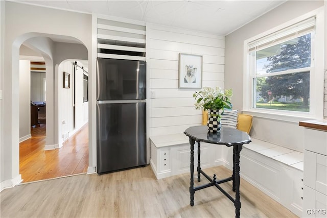200 Audubon Rd, Manlius, NY 13066 - kitchen with freestanding refrigerator, light wood-style floors, and arched walkways