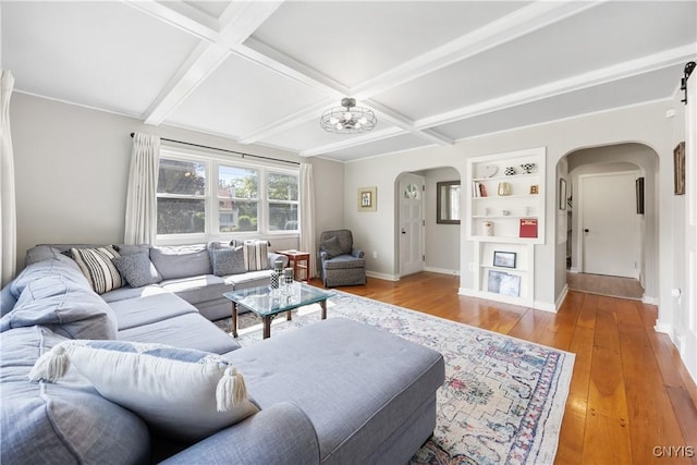 200 Audubon Rd, Manlius, NY 13066 - living room featuring arched walkways, coffered ceiling, light wood-style floors, beamed ceiling, and built in features