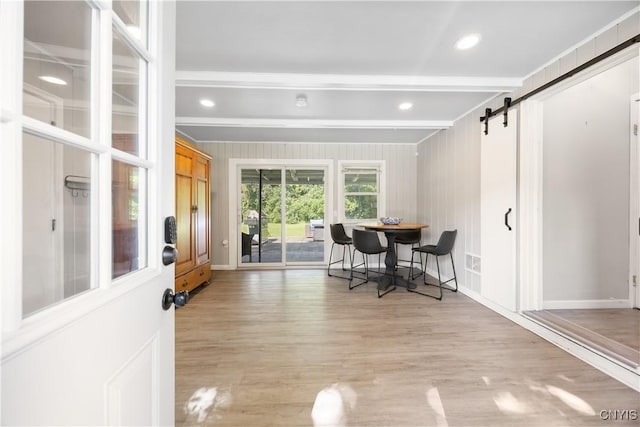 200 Audubon Rd, Manlius, NY 13066 - dining area featuring a barn door, wood finished floors, ornamental molding, and beam ceiling