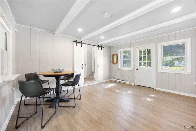 200 Audubon Rd, Manlius, NY 13066 - dining area featuring a baseboard radiator, a barn door, beamed ceiling, and light wood finished floors