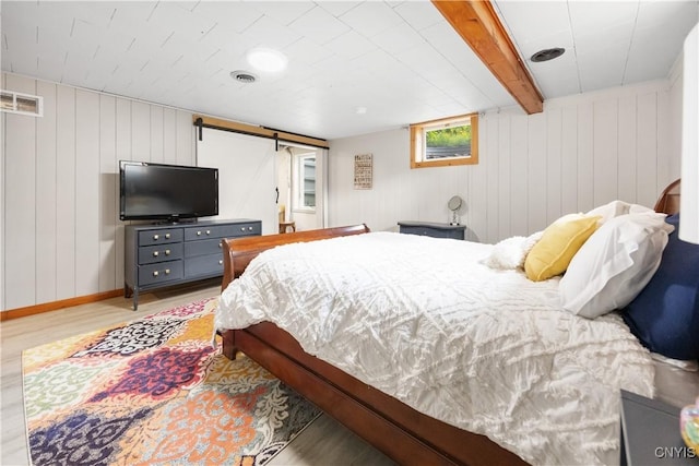 200 Audubon Rd, Manlius, NY 13066 - bedroom with light wood-style floors and a barn door