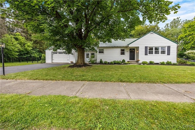 200 Audubon Rd, Manlius, NY 13066 - ranch-style house featuring asphalt driveway, a front yard, and a metal roof