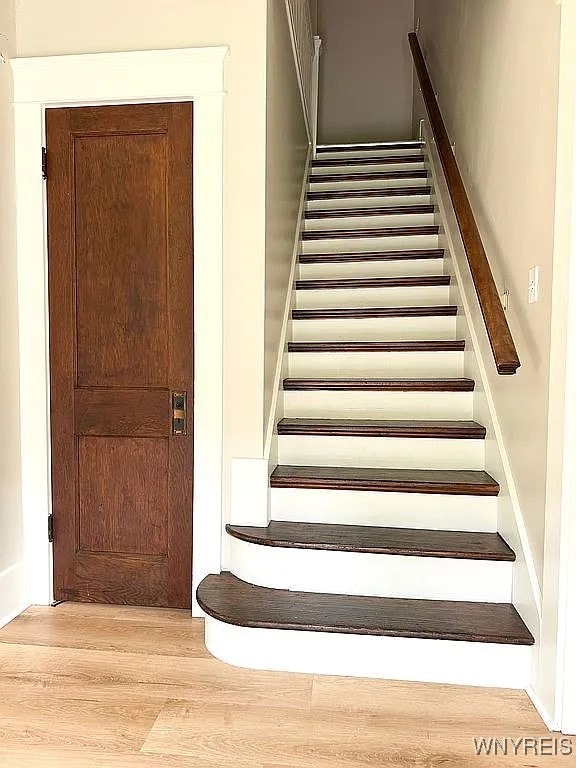 10448 Clarence Center Rd, Clarence, NY 14031 - stairs with wood finished floors