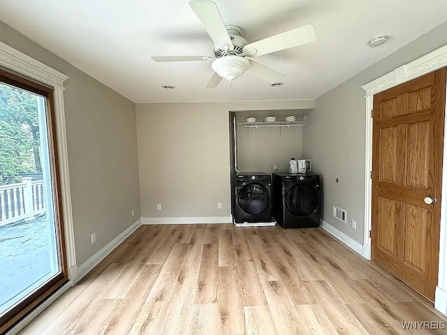 10448 Clarence Center Rd, Clarence, NY 14031 - laundry room featuring independent washer and dryer, light wood-style floors, and a ceiling fan