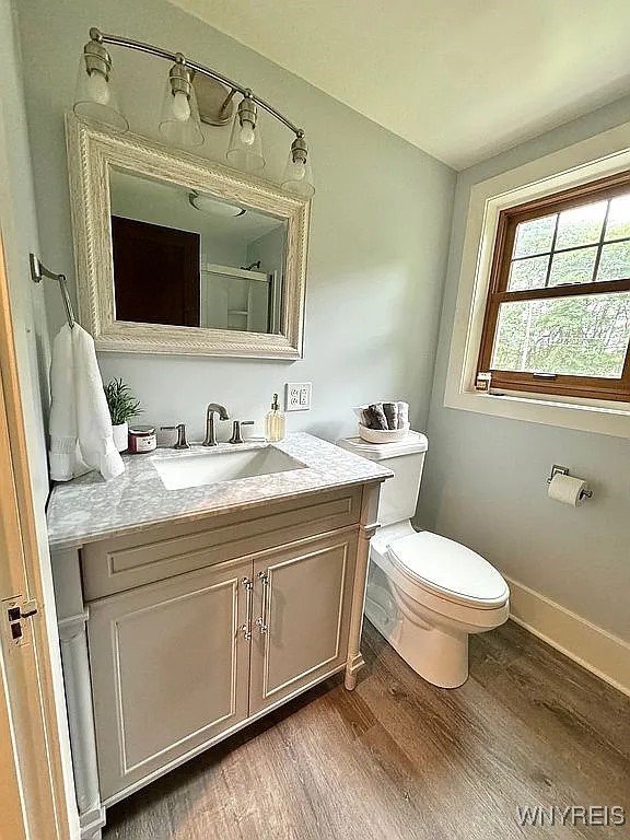 10448 Clarence Center Rd, Clarence, NY 14031 - bathroom with vanity and wood finished floors