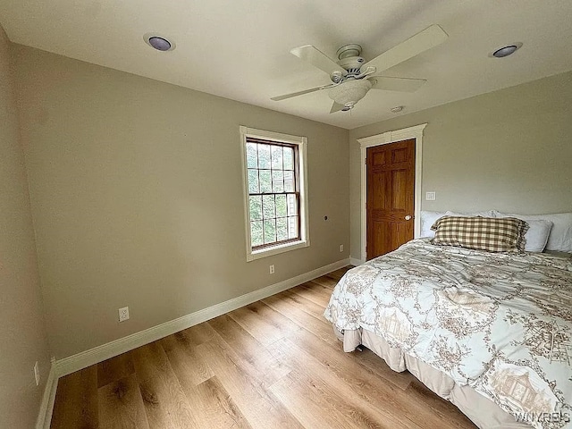 10448 Clarence Center Rd, Clarence, NY 14031 - bedroom with light wood-style flooring and a ceiling fan