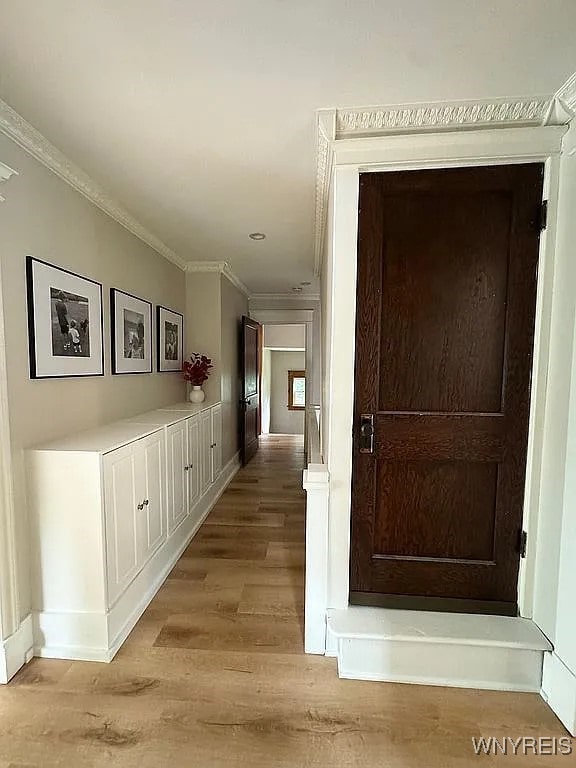 10448 Clarence Center Rd, Clarence, NY 14031 - hall with crown molding and light wood finished floors