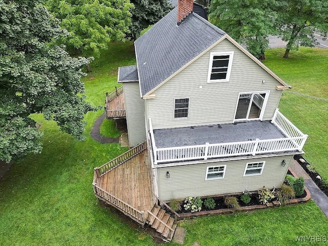 10448 Clarence Center Rd, Clarence, NY 14031 - rear view of house with a chimney, a shingled roof, a yard, and a wooden deck