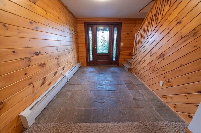 817 Flax Island Rd, Otego, NY 13825 - doorway with a baseboard heating unit, stone tile floors, wood walls, and stairs
