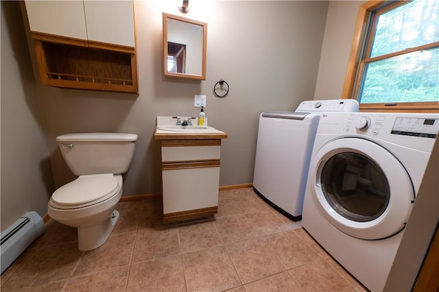 817 Flax Island Rd, Otego, NY 13825 - washroom featuring a baseboard radiator, separate washer and dryer, and light tile patterned floors