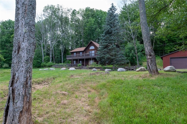 817 Flax Island Rd, Otego, NY 13825 - view of grassy yard with a deck, a detached garage, an outdoor structure, and a wooded view