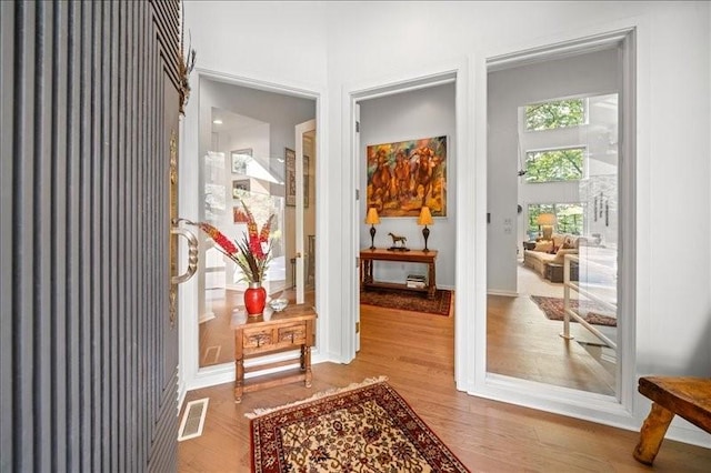 823 Skylane, Union, NY 13760 - doorway to outside featuring wood finished floors and baseboards