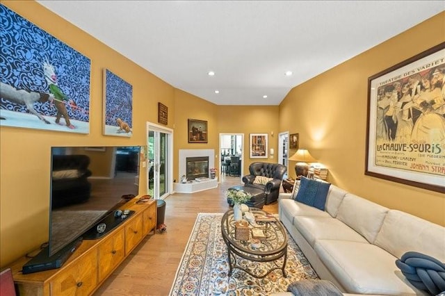 823 Skylane, Union, NY 13760 - living room with light wood-style flooring, a glass covered fireplace, and recessed lighting