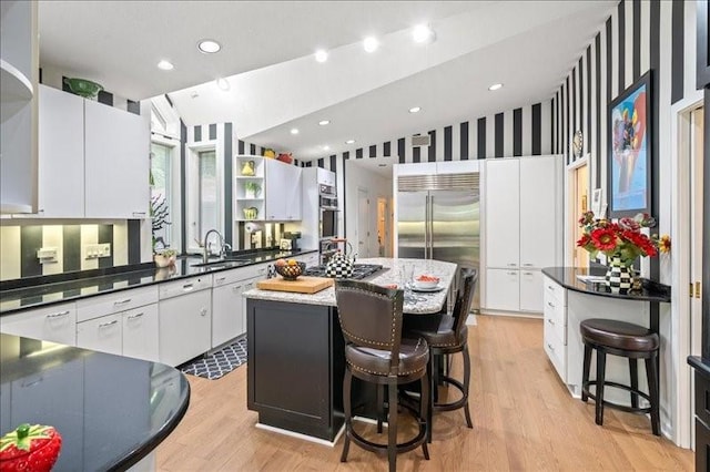 823 Skylane, Union, NY 13760 - kitchen with stainless steel appliances, light wood-style floors, open shelves, a kitchen island, and recessed lighting