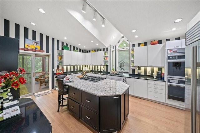 823 Skylane, Union, NY 13760 - kitchen with open shelves, lofted ceiling, appliances with stainless steel finishes, white cabinets, and recessed lighting