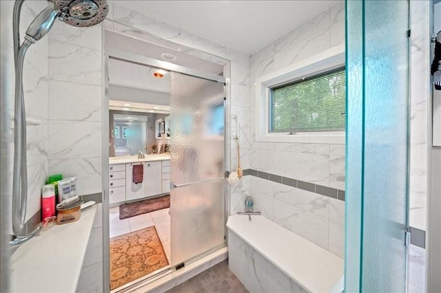 823 Skylane, Union, NY 13760 - bathroom with vanity, a shower with door, a tub with marble appearance, and tile patterned floors