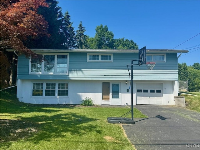 210 Wynnfield Dr, Camillus, NY 13219 - view of front facade featuring an attached garage, a front yard, and driveway