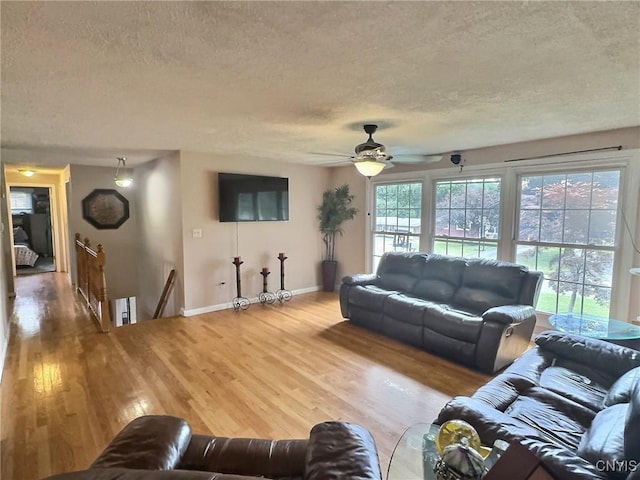 210 Wynnfield Dr, Camillus, NY 13219 - living room with a textured ceiling, wood finished floors, and ceiling fan