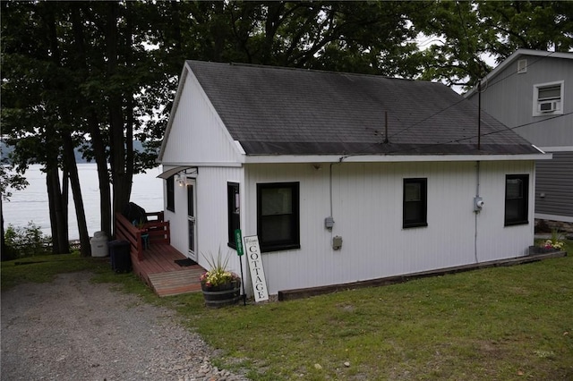 5681 Leidenfrost Adams Rd, Hector, NY 14841 - view of front of property featuring a wooden deck, a front lawn, and roof with shingles