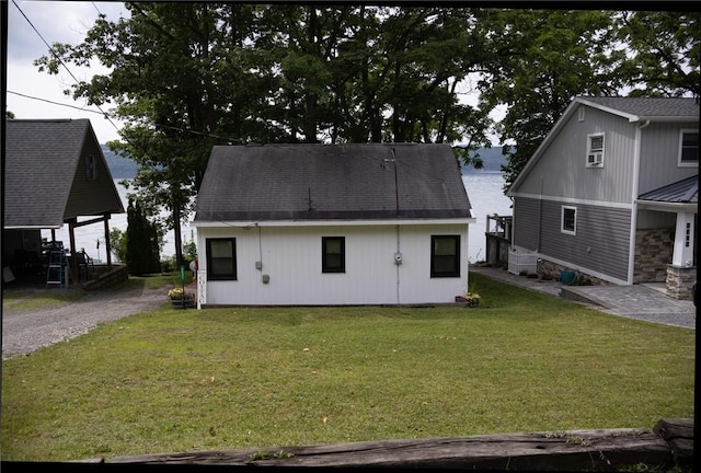 5681 Leidenfrost Adams Rd, Hector, NY 14841 - back of property with a lawn and gravel driveway