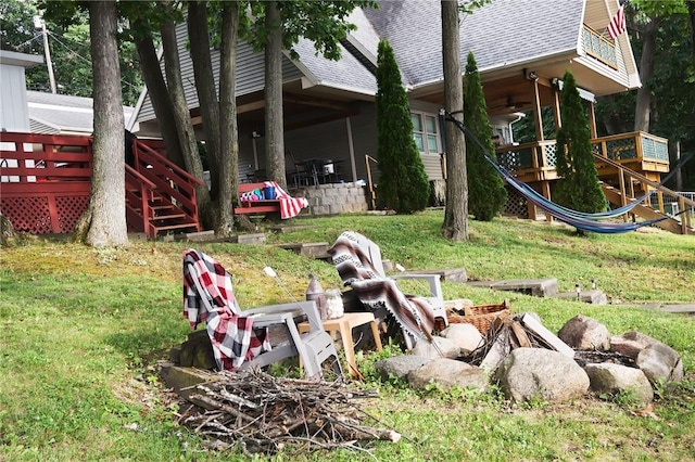 5681 Leidenfrost Adams Rd, Hector, NY 14841 - view of grassy yard with a ceiling fan, a wooden deck, and stairway