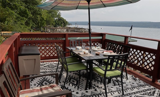 5681 Leidenfrost Adams Rd, Hector, NY 14841 - wooden deck featuring a water view and outdoor dining area