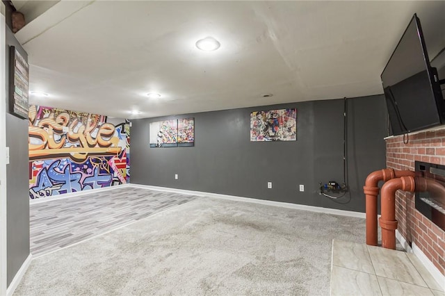 209 Thompson Rd, Henrietta, NY 14623 - finished basement with carpet floors and a brick fireplace