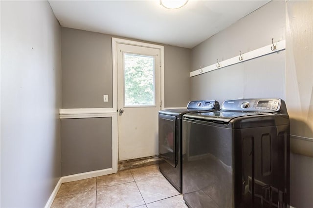 209 Thompson Rd, Henrietta, NY 14623 - laundry area with washing machine and clothes dryer and light tile patterned flooring