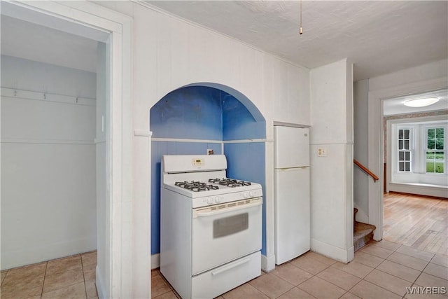7709 Olean Rd, Holland, NY 14080 - kitchen with white appliances and light tile patterned floors
