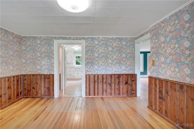 7709 Olean Rd, Holland, NY 14080 - unfurnished room featuring hardwood / wood-style floors, wainscoting, and wallpapered walls