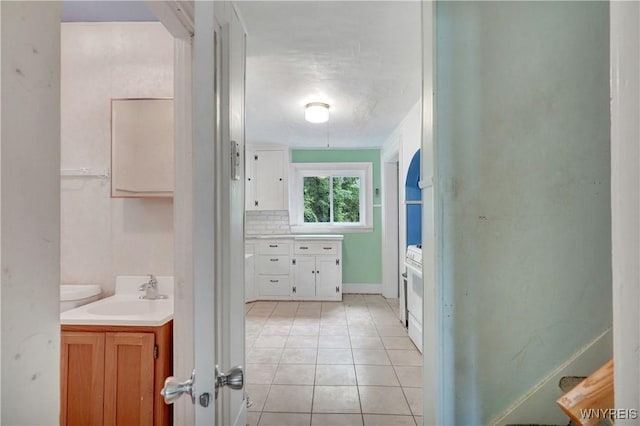 7709 Olean Rd, Holland, NY 14080 - bathroom with vanity, tile patterned floors, and decorative backsplash