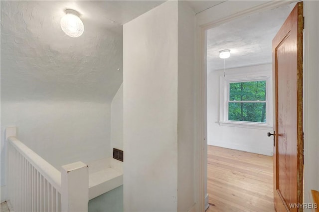 7709 Olean Rd, Holland, NY 14080 - hallway with light wood-type flooring and an upstairs landing