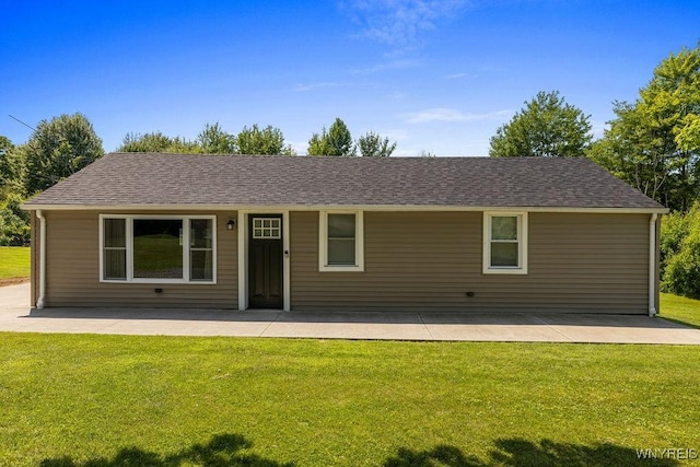 9184 Newcomb Rd, Evans, NY 14006 - ranch-style house featuring a front yard, a patio area, and a shingled roof