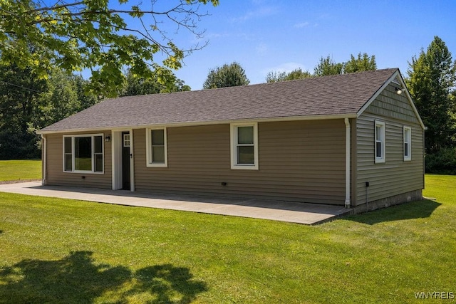 9184 Newcomb Rd, Evans, NY 14006 - view of front facade featuring a patio, a front lawn, and roof with shingles