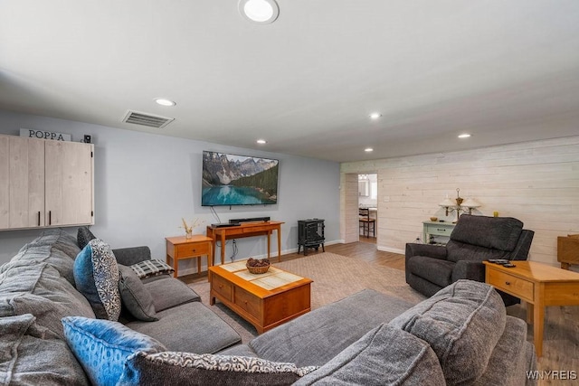 9184 Newcomb Rd, Evans, NY 14006 - living area featuring light wood-style floors, recessed lighting, and wood walls