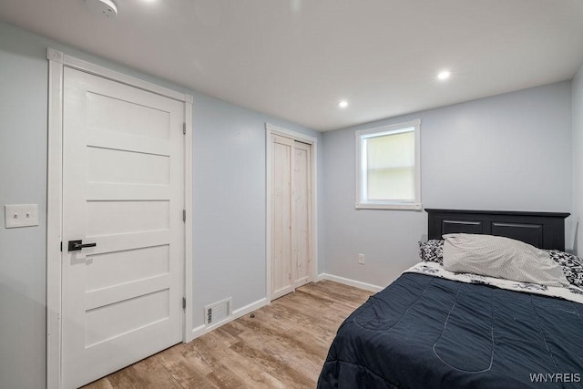 9184 Newcomb Rd, Evans, NY 14006 - bedroom with wood finished floors, recessed lighting, and a closet